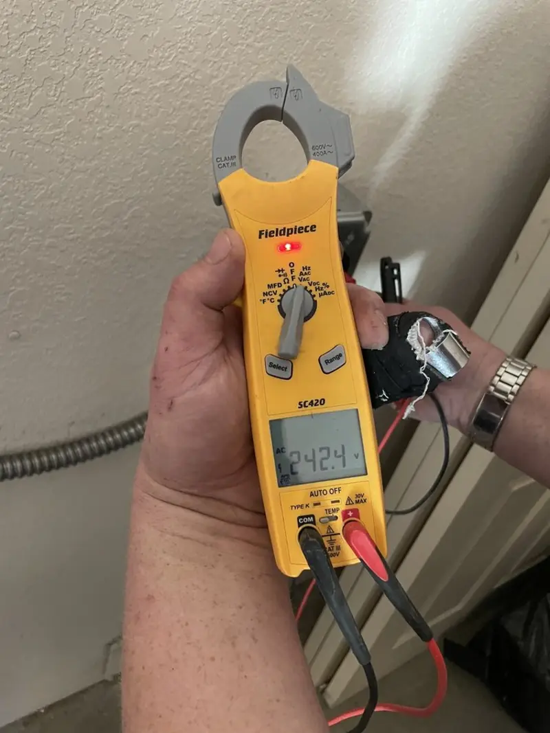 Voltage testing with clamp meter during Whole House Surge Protector in Noble